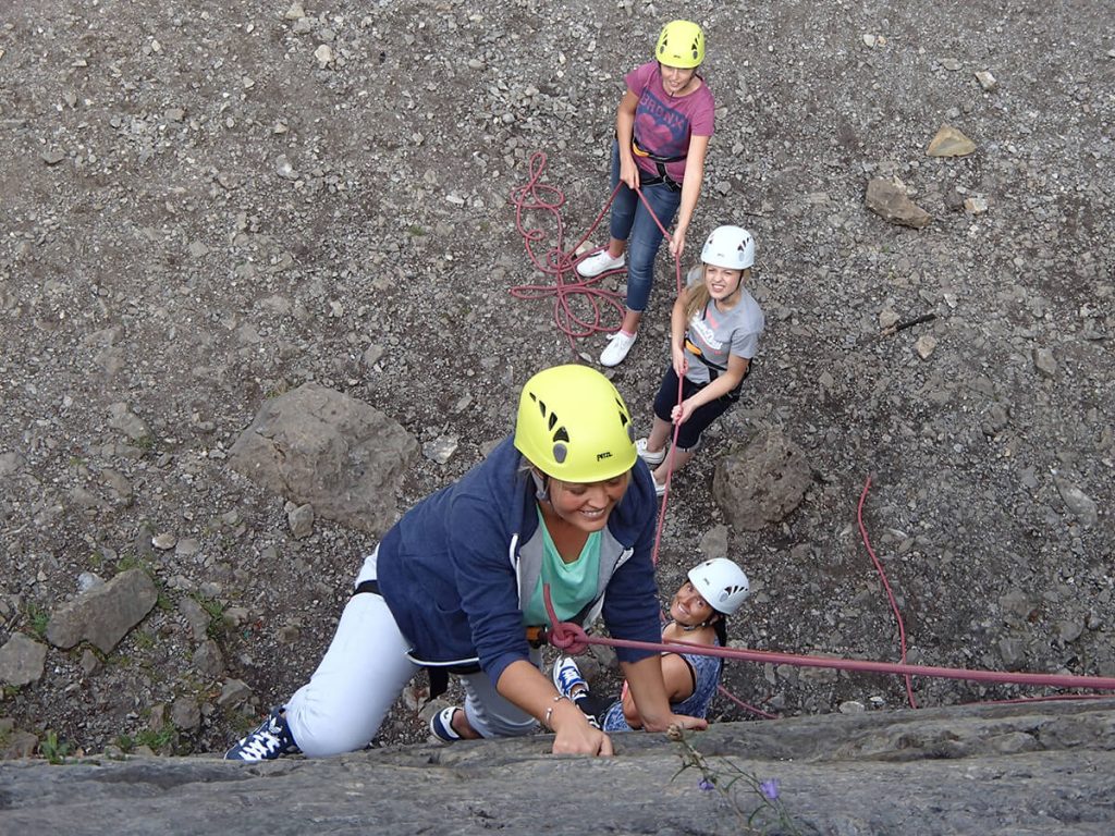 Rock Climbing group Group of happy ladies rock climbing