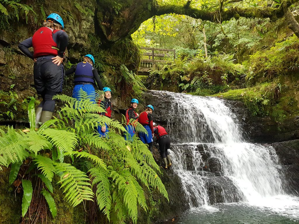 Group getting ready to jump off a waterfall