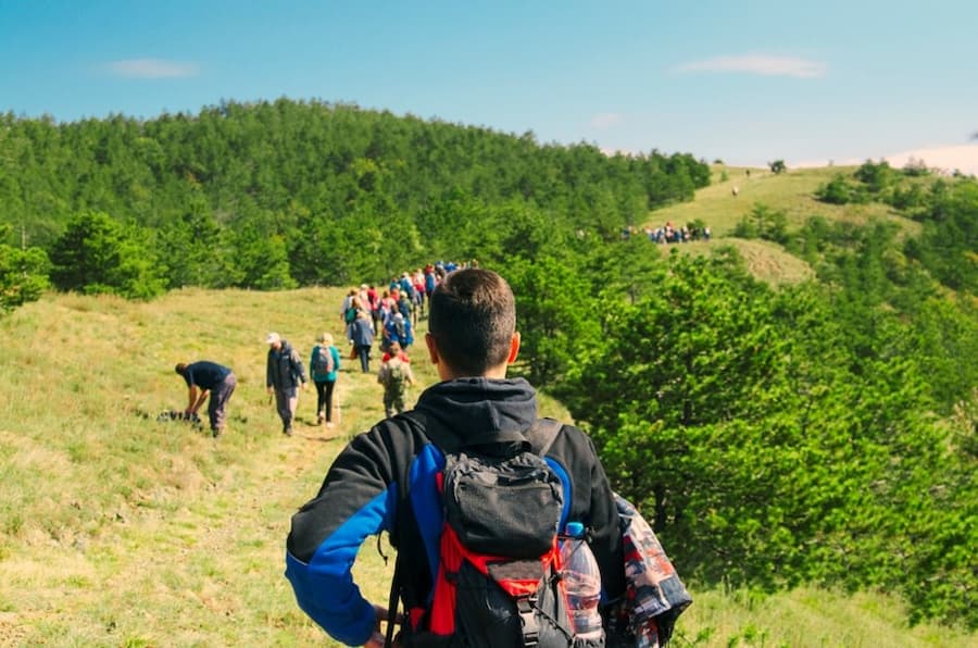 A group of people hiking on a hill