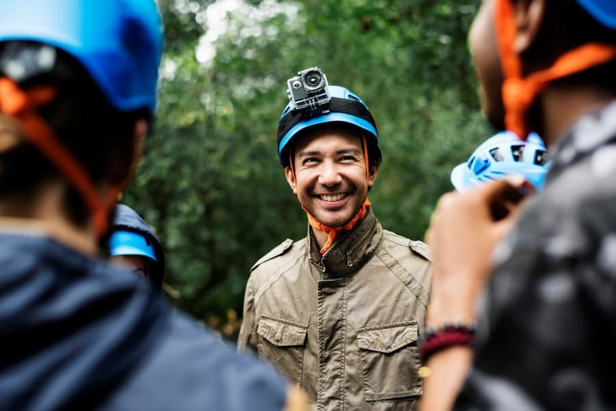 A person wearing a helmet with a camera on his head